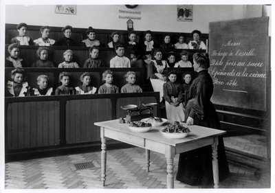 Young girls in a cookery lesson by French Photographer